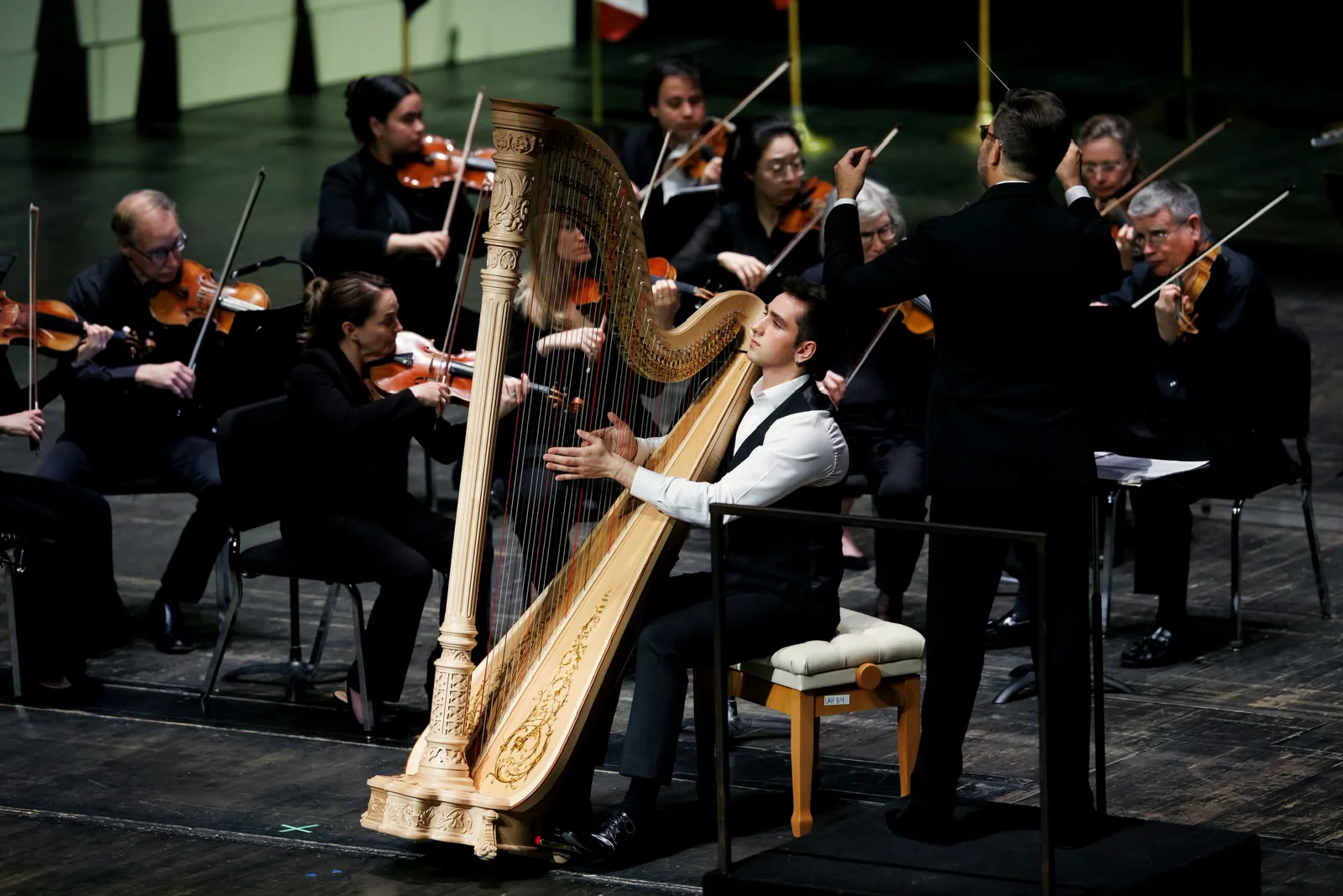 Huw Boucher performing as soloist with orchestra.